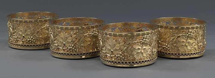 A Set of Four George III Silver-Gilt Wine Coasters